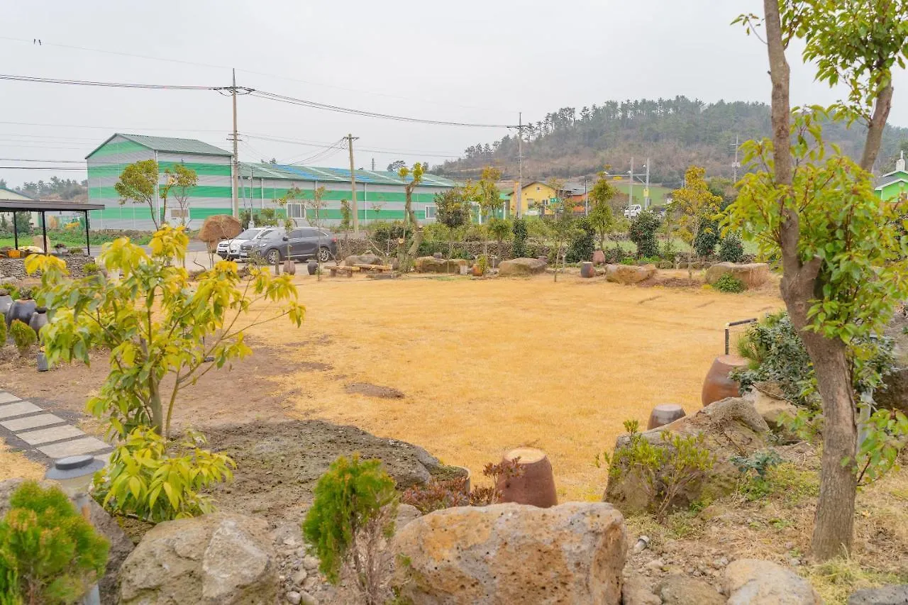 Farmer In Stone Jeju South Korea